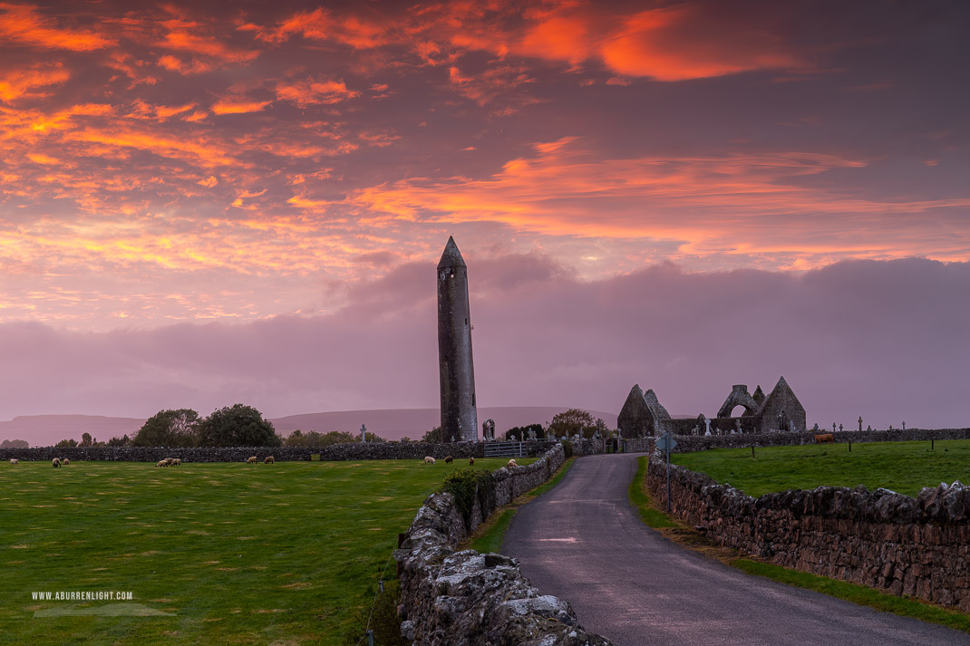 Kilmacduagh Monastery Burren Clare Ireland - church,gort,kilmacduagh,landmark,pink,september,summer,sunset,tower,portfolio,lowland