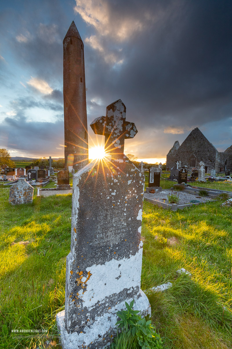 Kilmacduagh Monastery Burren Clare Ireland - grave,kilmacduagh,landmark,may,spring,sunset,sunstar,lowland,church,medieval,graves,cemetery