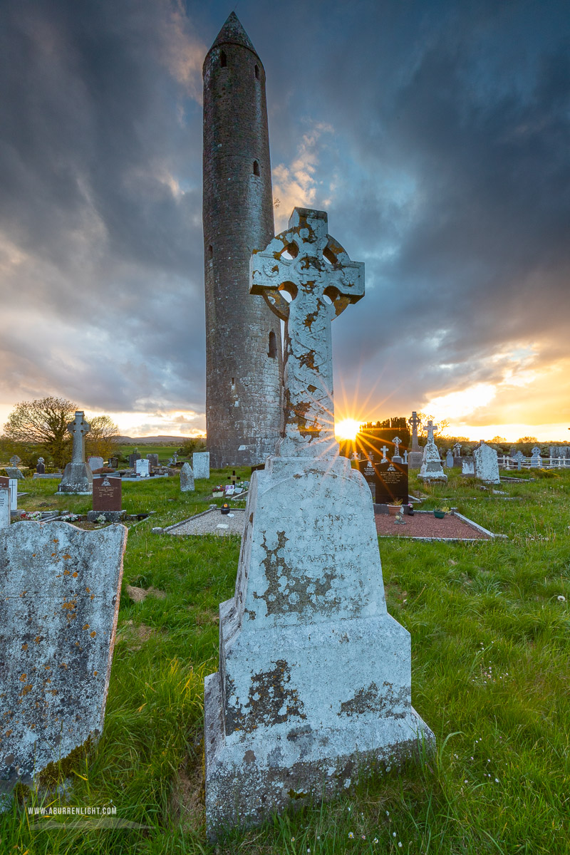 Kilmacduagh Monastery Burren Clare Ireland - grave,kilmacduagh,landmark,may,spring,sunset,sunstar,lowland,church,medieval,graves,cemetery