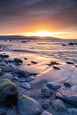 boulder,dusk,flaggy shore,golden,march,orange,sunset,winter,coast